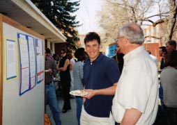 A faculty member talking to a student.